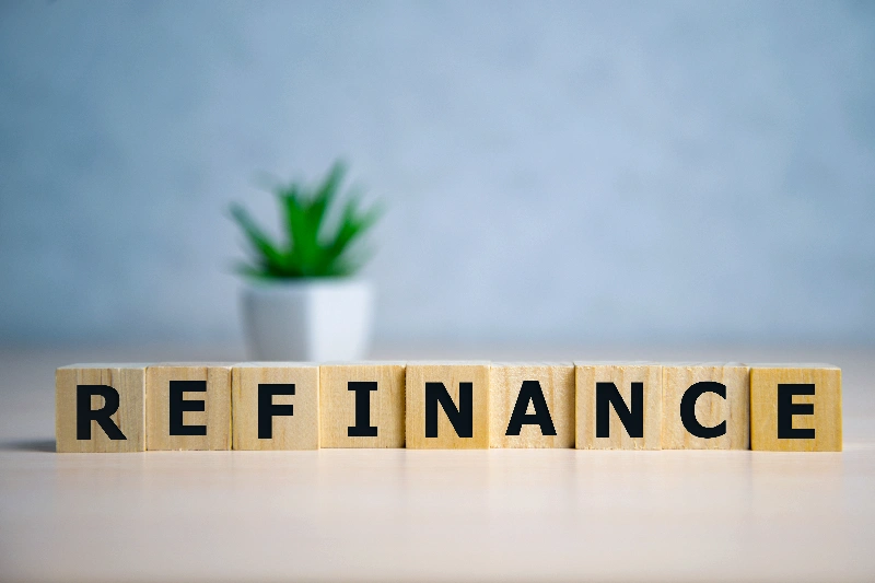 Focus on wooden blocks with letters refinance
